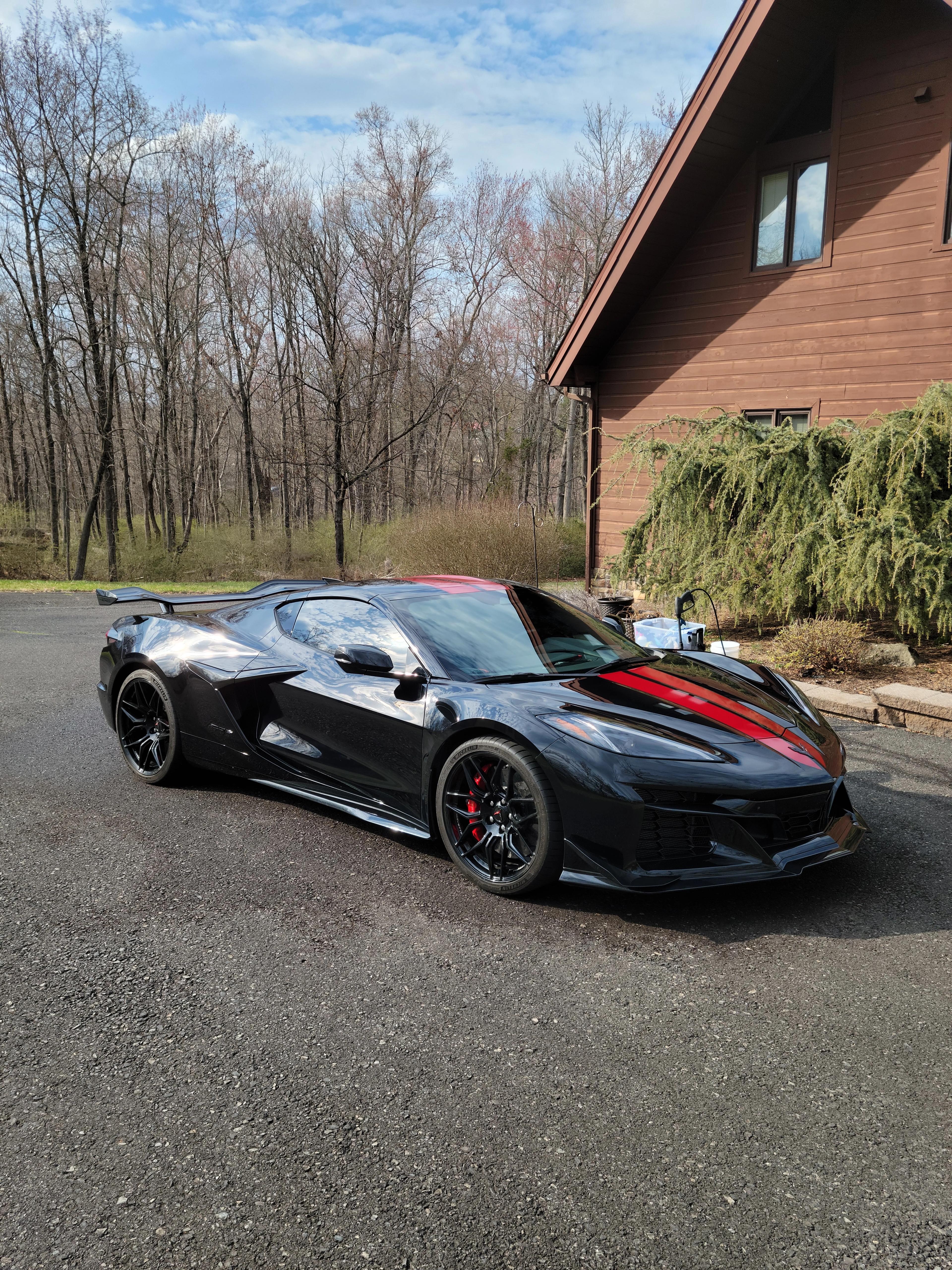 Black Corvette Z06 with red stripe after detail — West Chester PA