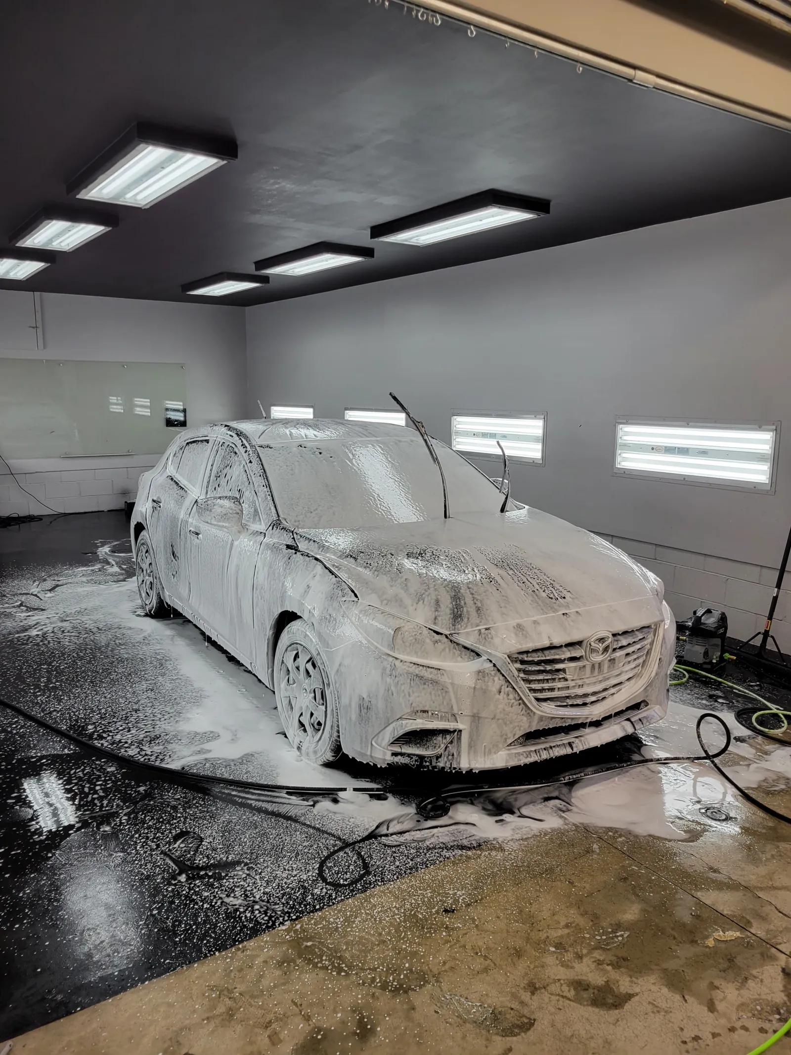 Grey Mazda3 under snow foam — GNelson Detailing West Chester PA