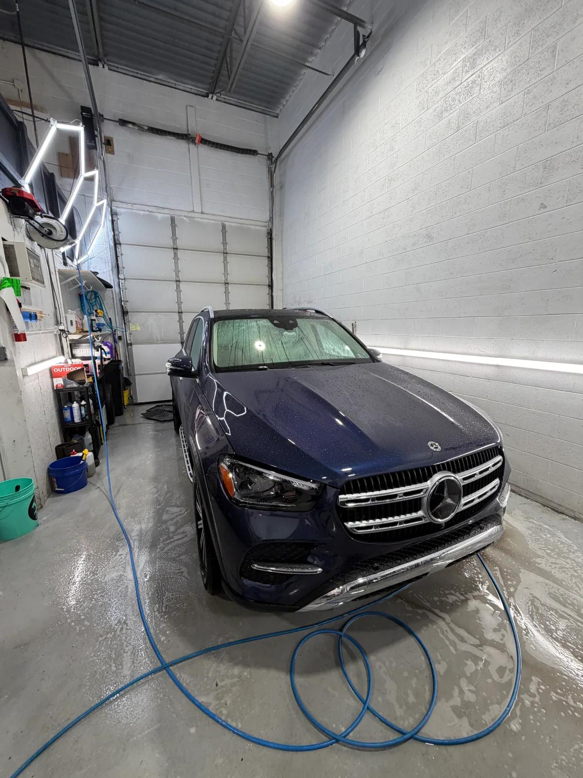 Navy Mercedes-Benz GLE being washed in the detail bay — West Chester PA